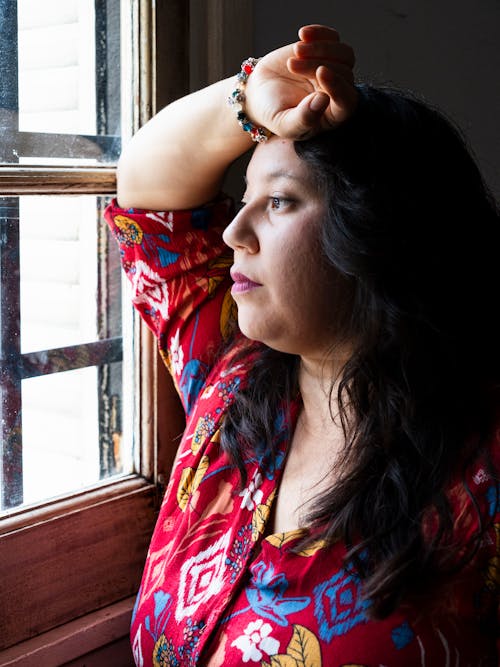 files/free-photo-of-woman-gazing-through-window-in-thoughtful-pose.jpg