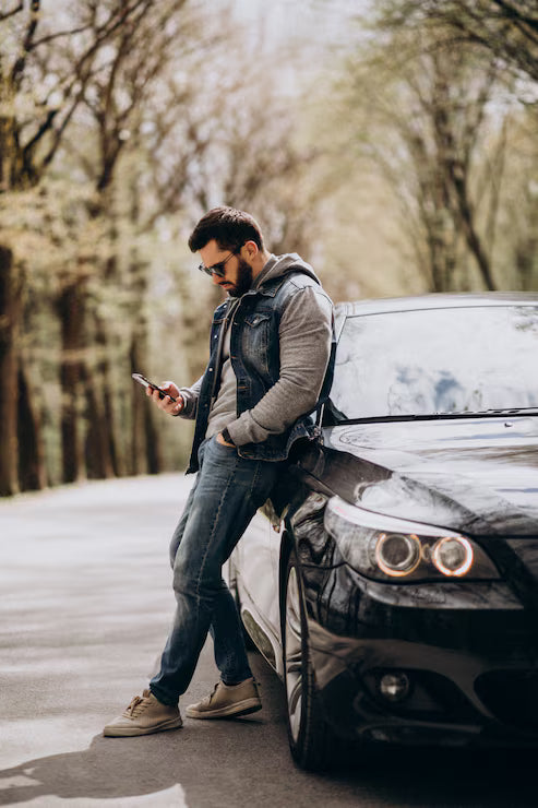 files/handsome-man-standing-by-car-park_1303-22268.avif
